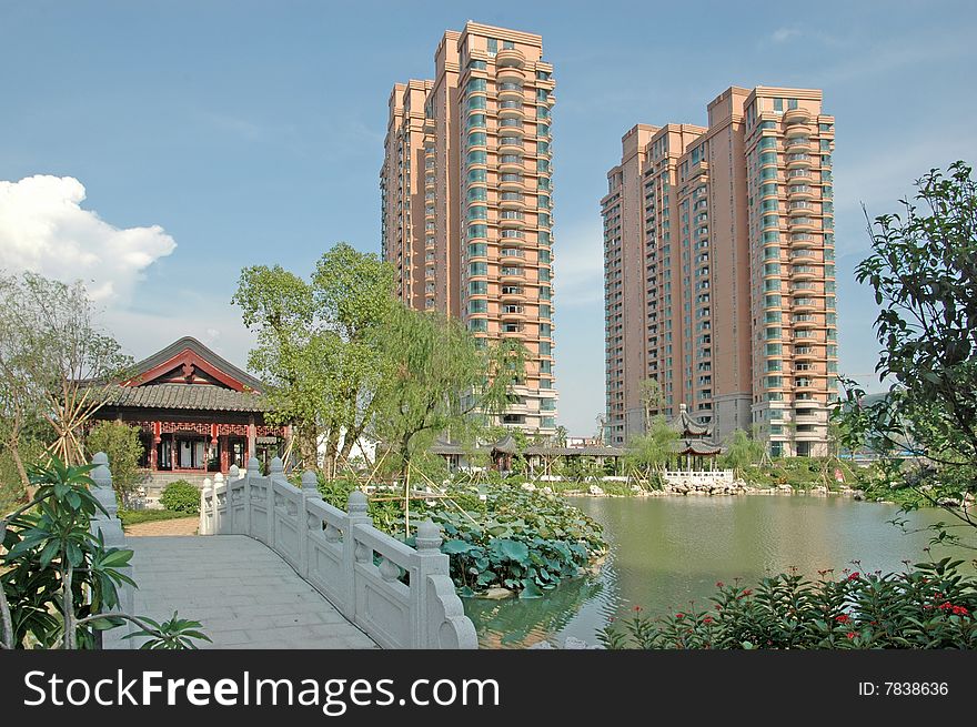 There are two upscale apartment block by the lakeside,a stone bridge leads to the pavilion of apartment community garden