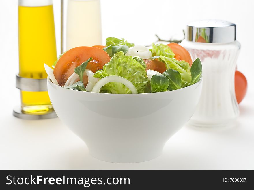 Fresh natural salad bowl tomato lettuce onion oil vinegar