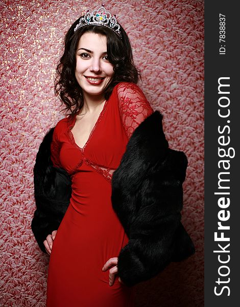 Beautiful girl posing on red wallpaper background. Beautiful girl posing on red wallpaper background