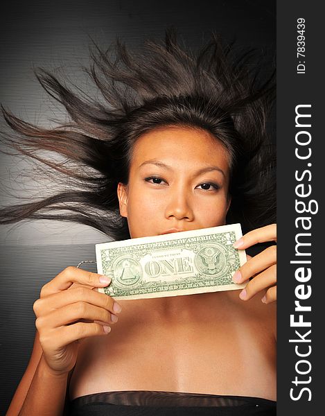 Asian Chinese Woman Holding A Dollar Bill