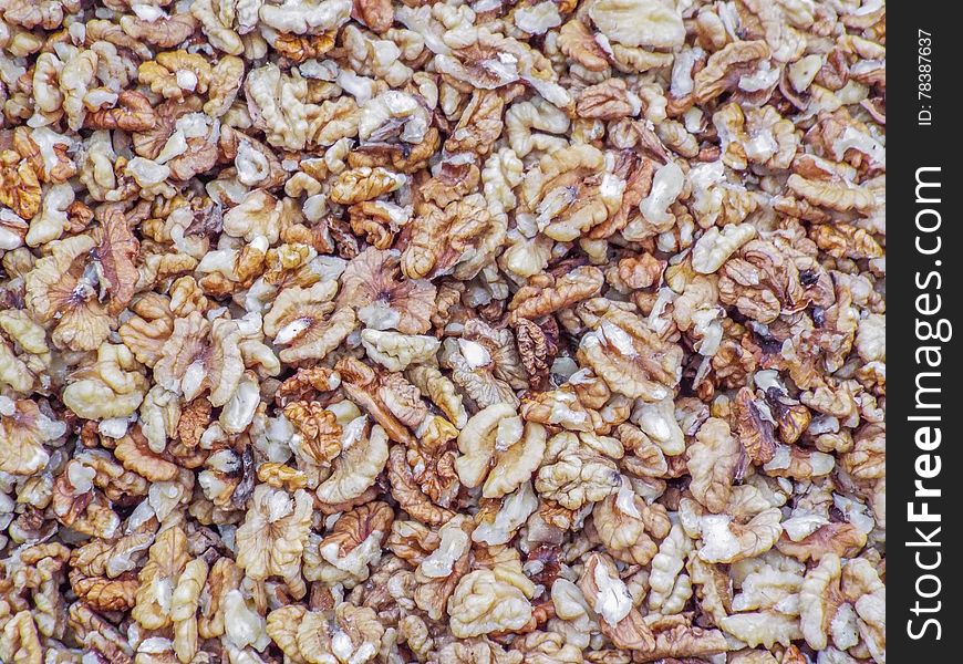 Delicious walnuts background in market