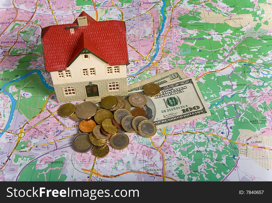 Miniature House on Money. Part of Series. See Portfolio For Similar Images