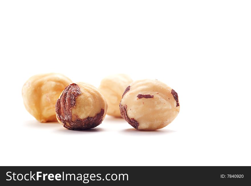 Four salted  nut isolated on a white background. Background blurred. Four salted  nut isolated on a white background. Background blurred.