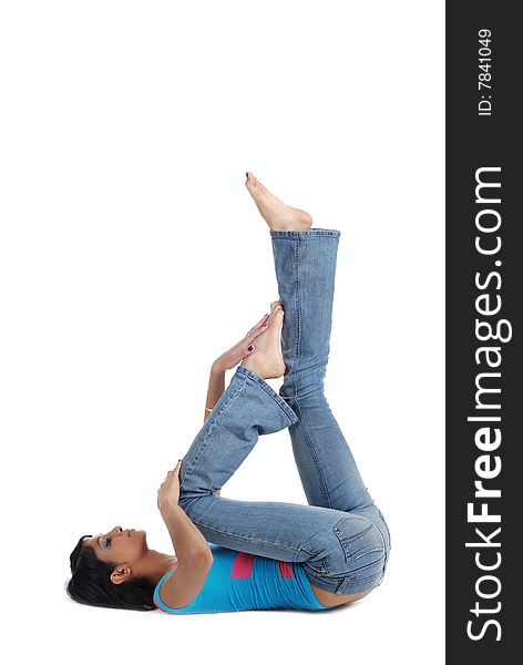 Girl posing on the floor isolated over white background