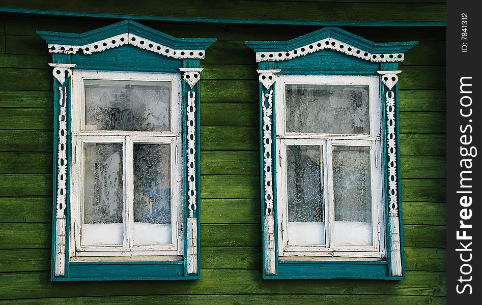 House window in the Russian village, decorated with a carving. House window in the Russian village, decorated with a carving.