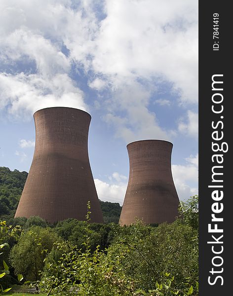 The three cooling towers of the coal-fired Ironbridge power station rise above the greenery of the surrounding gorge, close to where the industrial revolution began. The three cooling towers of the coal-fired Ironbridge power station rise above the greenery of the surrounding gorge, close to where the industrial revolution began.
