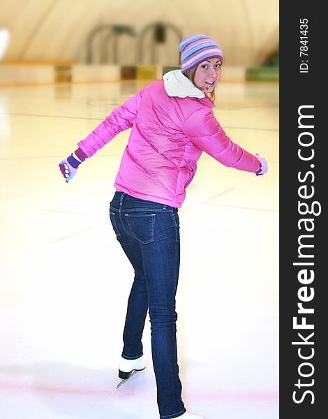 Beautiful girl  on skates, on a ice skating