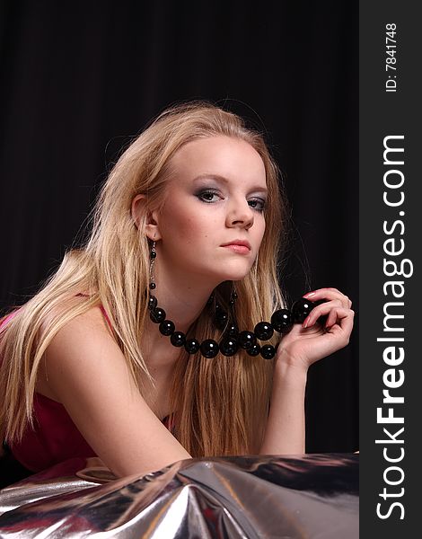 Beautiful blond fashion model posing in studio. Beautiful blond fashion model posing in studio