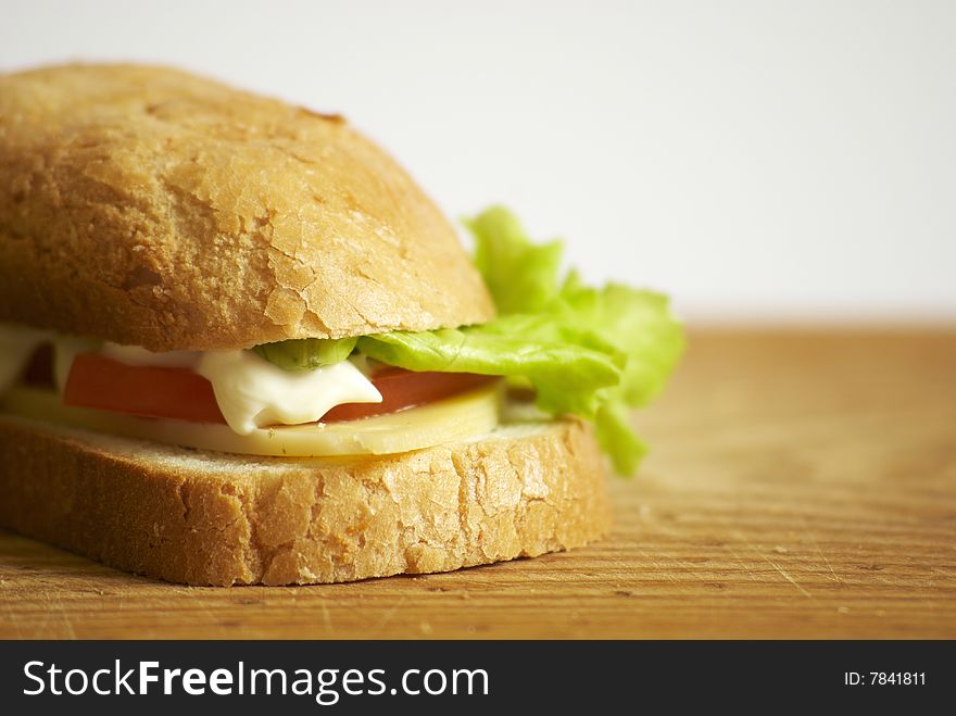 Fresh sandwich with cheese, tomato and salad