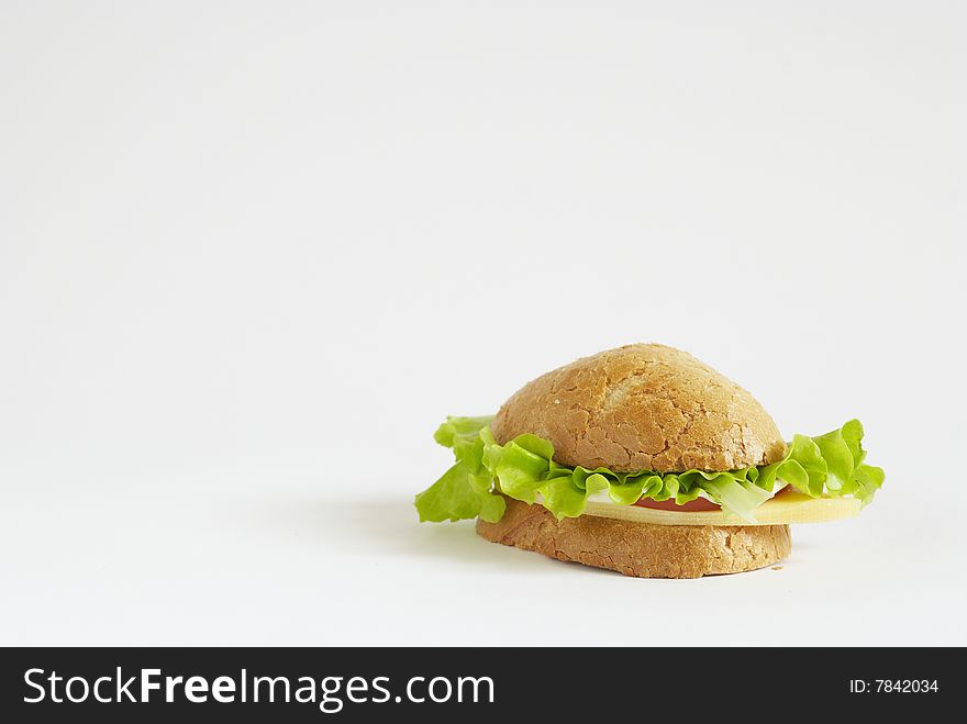 Sandwich with tomato, cheese and salad on white background. Sandwich with tomato, cheese and salad on white background