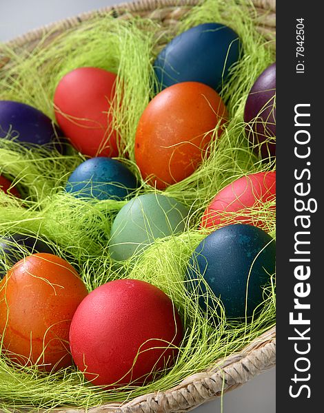 Easter eggs in basket on table