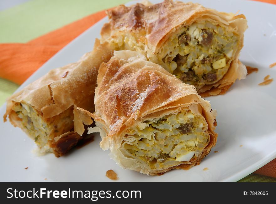 Meat pie with rice on plate