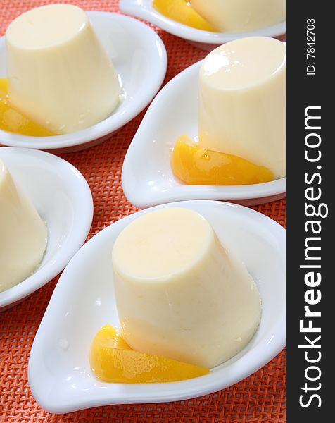 Yogurt dessert with peach fruit on plate