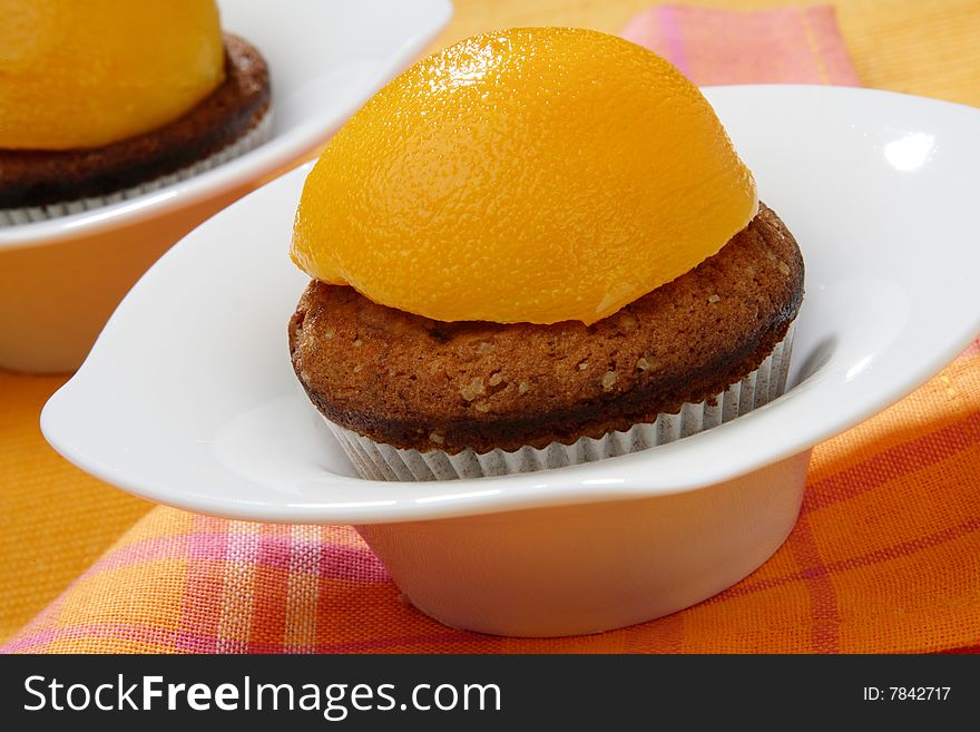 Baked dessert with peach fruit on plate
