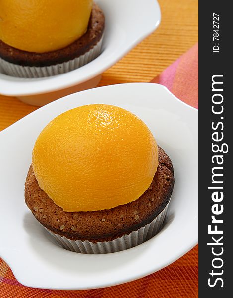 Baked dessert with peach fruit on plate