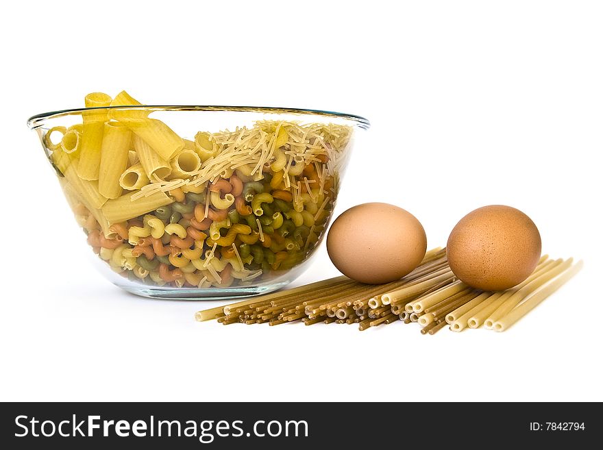 Colorful noodles and two eggs on white. Colorful noodles and two eggs on white