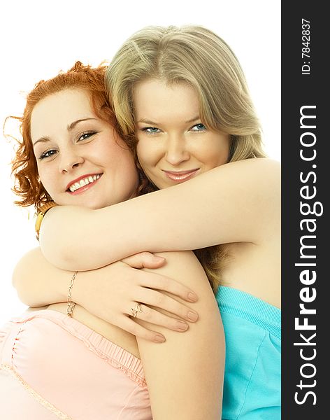 Portrait of two happy embracing friends against white background