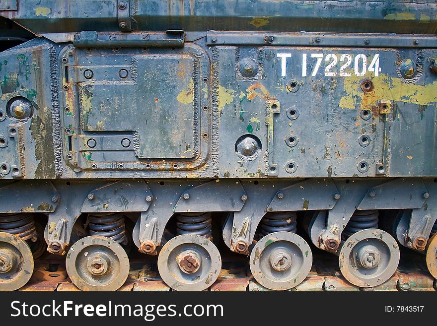 The side of an old, rusted, second world war tank, nice colors, beautiful texture