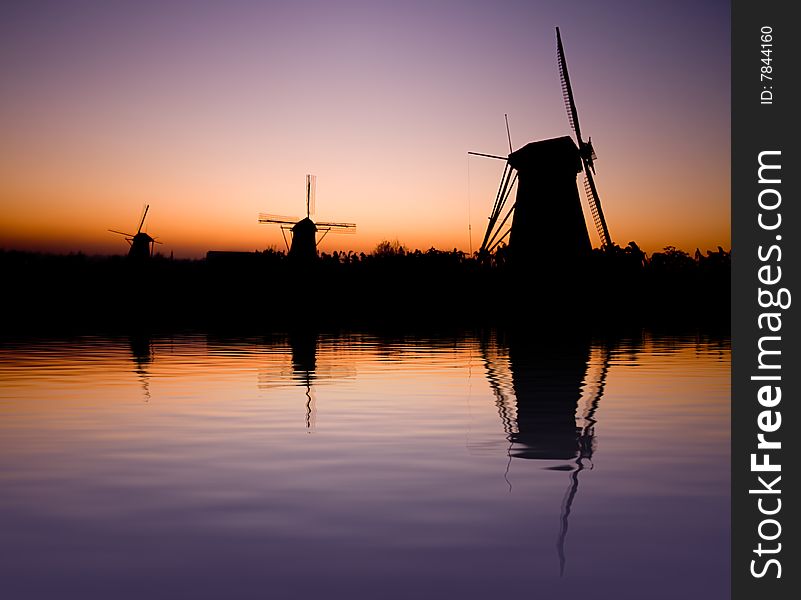 Dutch windmill with reflection in the water