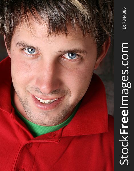 Male model against a rough brick wall background