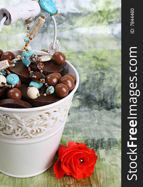 Bucket filled with sweets and blue beading. Bucket filled with sweets and blue beading