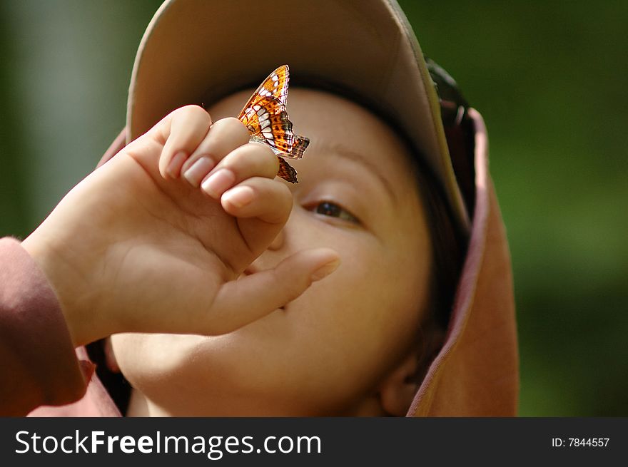 Picture Of A Happy Girl With A Butterfly