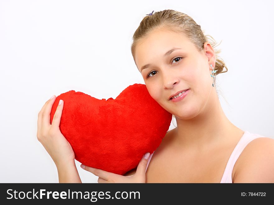 Girl holding a plush heart. Girl holding a plush heart