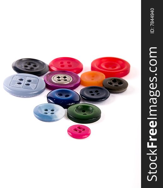 Colored sewing buttons on a white background