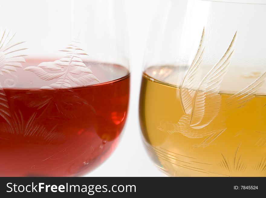 Two crystal wine-glassful with red and white wine
