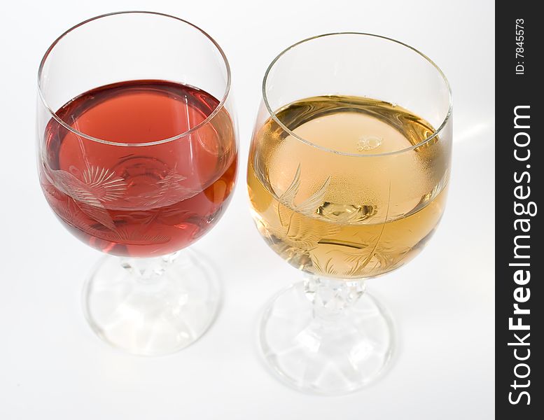 Two crystal wine-glassful with red and white wine