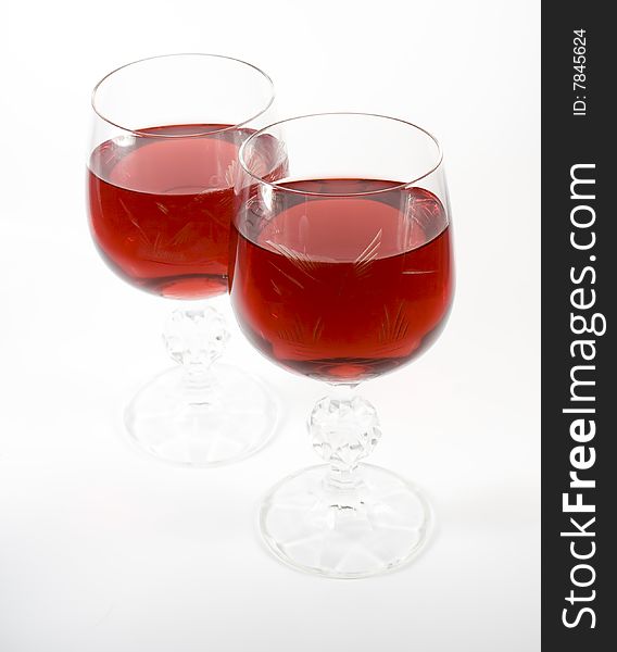 Two crystal wine-glassful with red wine