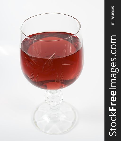 One crystal wine-glassful with red wine