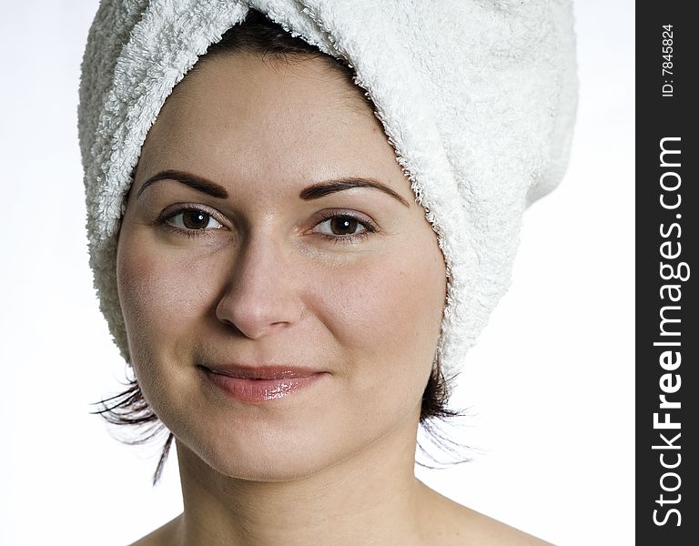 Beautiful young woman with towel on head