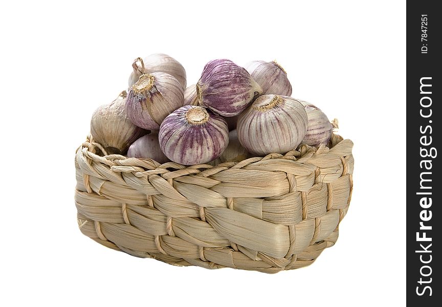 Garlic in basket on white background