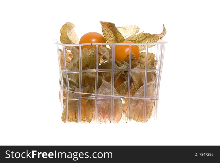 Basket of Phillis fruit isolated on white.