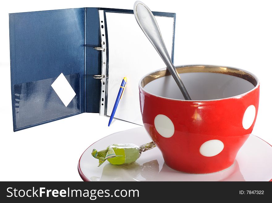 Tea cup and the folder under the light background