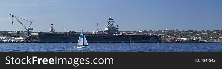 aircraft carrier docked in San Diego Bay. aircraft carrier docked in San Diego Bay