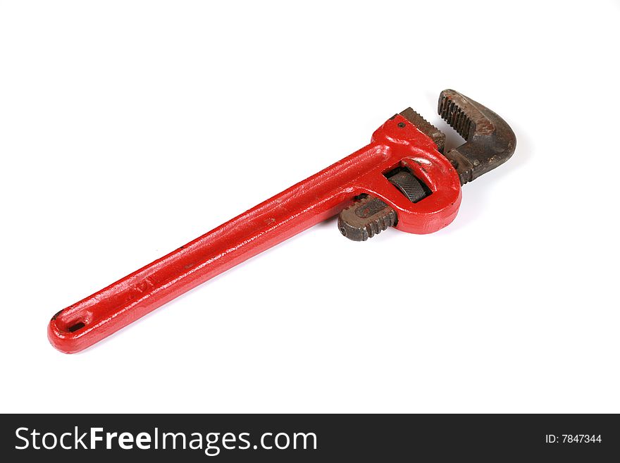 Red pipe wrench isolated on white