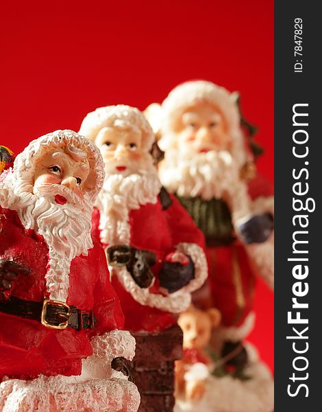 Three Santa Claus Figurines