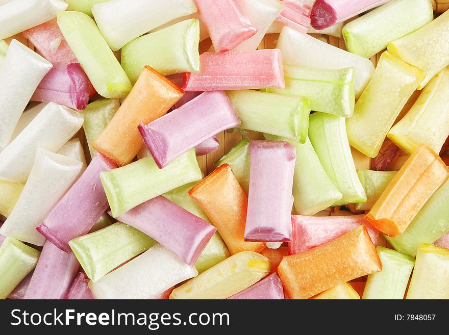 Colorful sherbet straw sweets as a background and texture. Colorful sherbet straw sweets as a background and texture