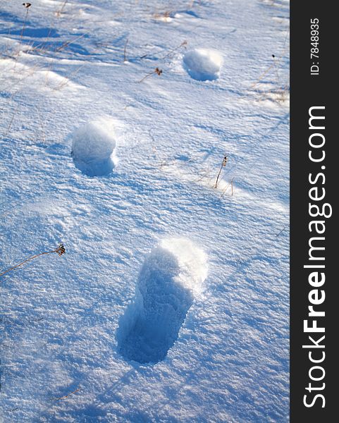 Three footsteps in deep snow on north field. Three footsteps in deep snow on north field