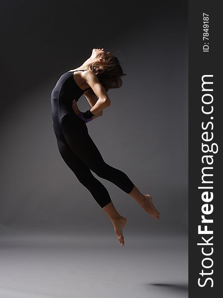 Young modern style dancer posing