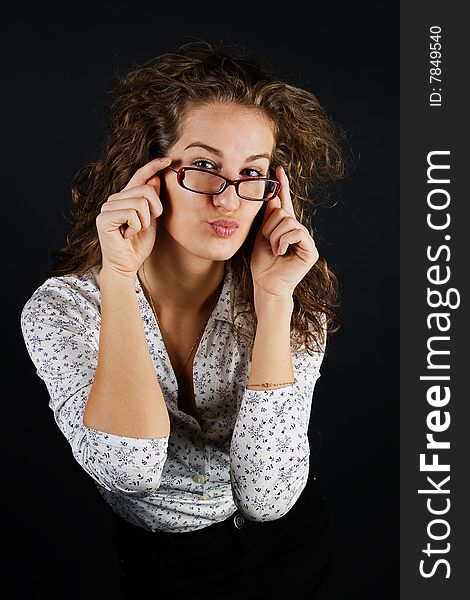 Business women in glasses on black background. Business women in glasses on black background