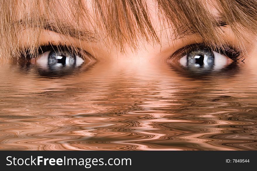 Beautiful woman eyes reflected in the water. Beautiful woman eyes reflected in the water