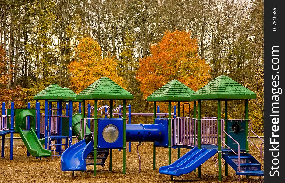 A colorful playground in a park in autumn. A colorful playground in a park in autumn