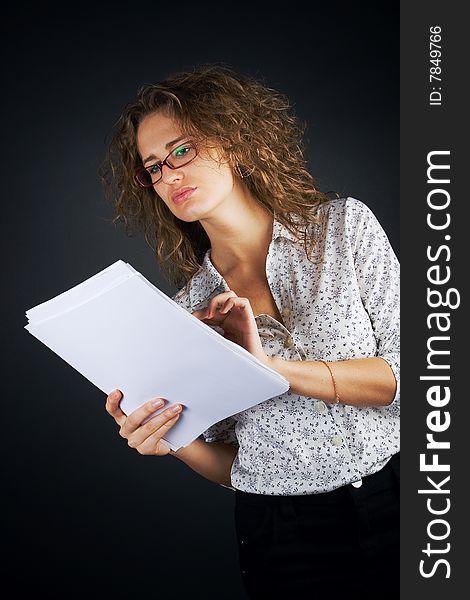 Business women with documents on black background. Business women with documents on black background