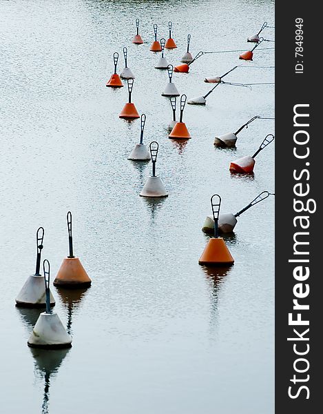 Serene scene with red and white buoys