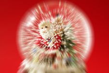 Santa Claus Figurine On A Glass Snowing Ball Royalty Free Stock Image