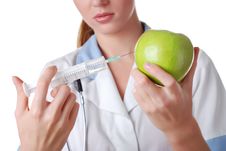 Nurse With Syringe And Apple Royalty Free Stock Photography Nurse With Syringe And Apple Royalty Free Stock Photography