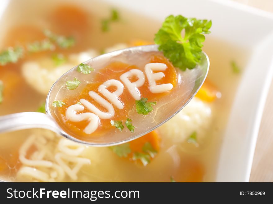 Noodle soup with dumplings and carrots